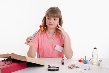 Image showing Pharmacist surprised pill for tweezers