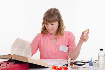 Image showing Pharmacist shocked by composition of powder