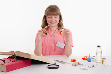 Image showing Pharmacist with two ampoules