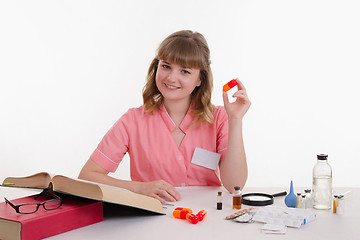 Image showing doctor with a big pill in hand