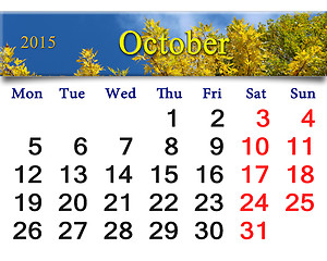 Image showing calendar for October of 2015 with autumn leaves and sky