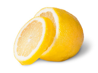 Image showing Half Of A Lemon With One Slice