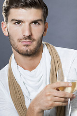 Image showing Sexy handsome man drinking white wine