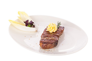 Image showing Grilled beef steak topped with butter and rosemary