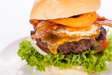 Image showing Delicious egg and bacon cheeseburger