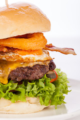 Image showing Delicious egg and bacon cheeseburger