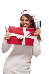 Image showing Woman holding a Christmas gift and bank card