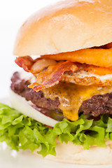 Image showing Delicious egg and bacon cheeseburger