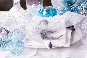 Image showing Stylish blue and silver Christmas table setting