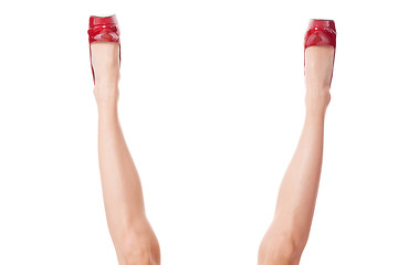 Image showing Sexy bare female legs in elegant red stilettos