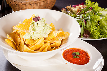 Image showing Crisp corn nachos with guacamole sauce