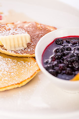 Image showing tasty sweet pancakes with vanilla icecream and topping