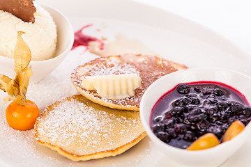 Image showing tasty sweet pancakes with vanilla icecream and topping