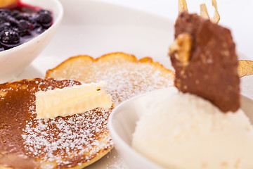 Image showing tasty sweet pancakes with vanilla icecream and topping