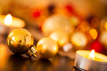 Image showing Warm gold and red Christmas candlelight background