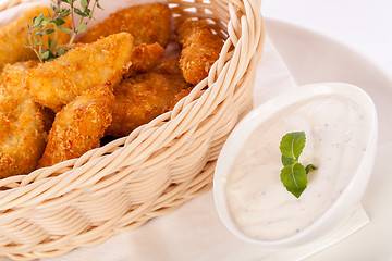 Image showing Crumbed chicken nuggets in a basket