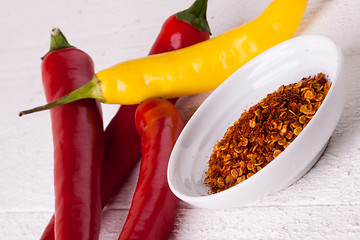 Image showing Fresh red and yellow chili peppers with spice