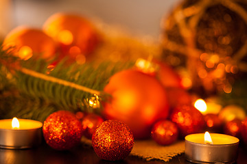 Image showing Warm gold and red Christmas candlelight background