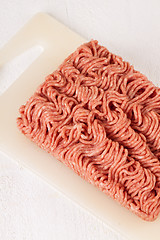 Image showing Block of commercial beef mince from a store