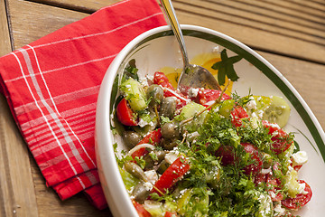 Image showing Bowl of Marinated Greek Salad with Red Napkin