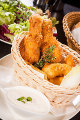 Image showing Crisp crunchy golden chicken legs and wings