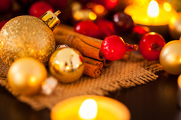 Image showing Warm gold and red Christmas candlelight background