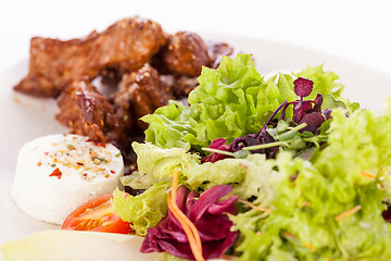 Image showing grilled beef stripes fresh salad and goat cheese