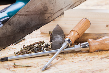 Image showing Drill with timber, screwdrivers and screws