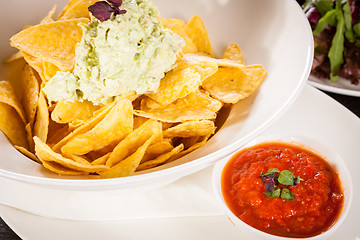 Image showing Crisp corn nachos with guacamole sauce