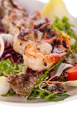 Image showing Grilled prawns with endive salad and jacket potato