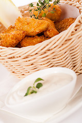 Image showing Crumbed chicken nuggets in a basket