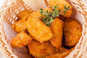 Image showing Crumbed chicken nuggets in a basket