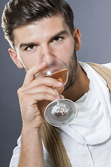 Image showing Sexy handsome man drinking white wine