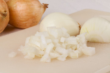Image showing Whole, peeled and diced brown onion