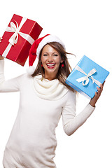 Image showing Vivacious woman in a Santa hat celebrating Xmas