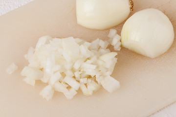 Image showing Whole, peeled and diced brown onion