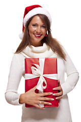 Image showing Pretty woman in a Santa hat with a large gift