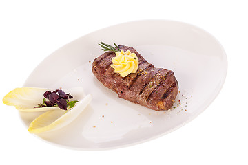 Image showing Grilled beef steak topped with butter and rosemary