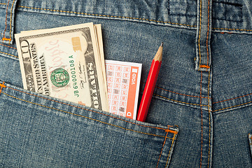 Image showing US money and lottery bet slip in pocket