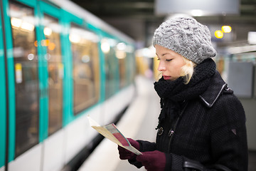 Image showing Lady waiting on subway station platform.