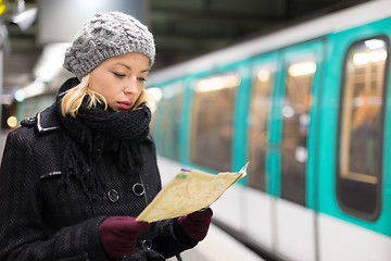 Image showing Lady waiting on subway station platform.