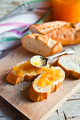 Image showing pieces of baguette with orange marmalade