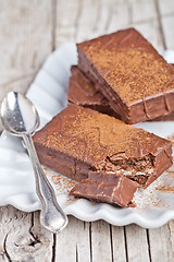 Image showing dark chocolate cakes and spoon