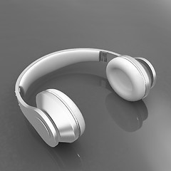 Image showing White headphones isolated on a red background 