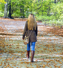 Image showing Young woman walking in park
