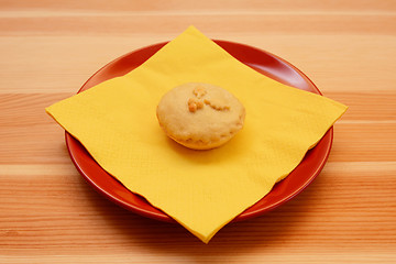 Image showing Homemade Christmas mince pie with a yellow napkin