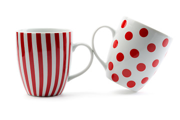 Image showing Two porcelain cup with red stripes and dots
