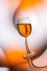 Image showing Glass of whiskey matured in reflections.