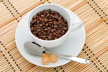 Image showing cup with a spoon and sugar with coffee beans