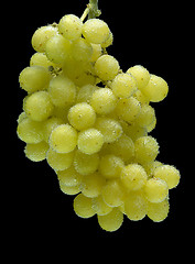 Image showing bunch of grapes on a black background